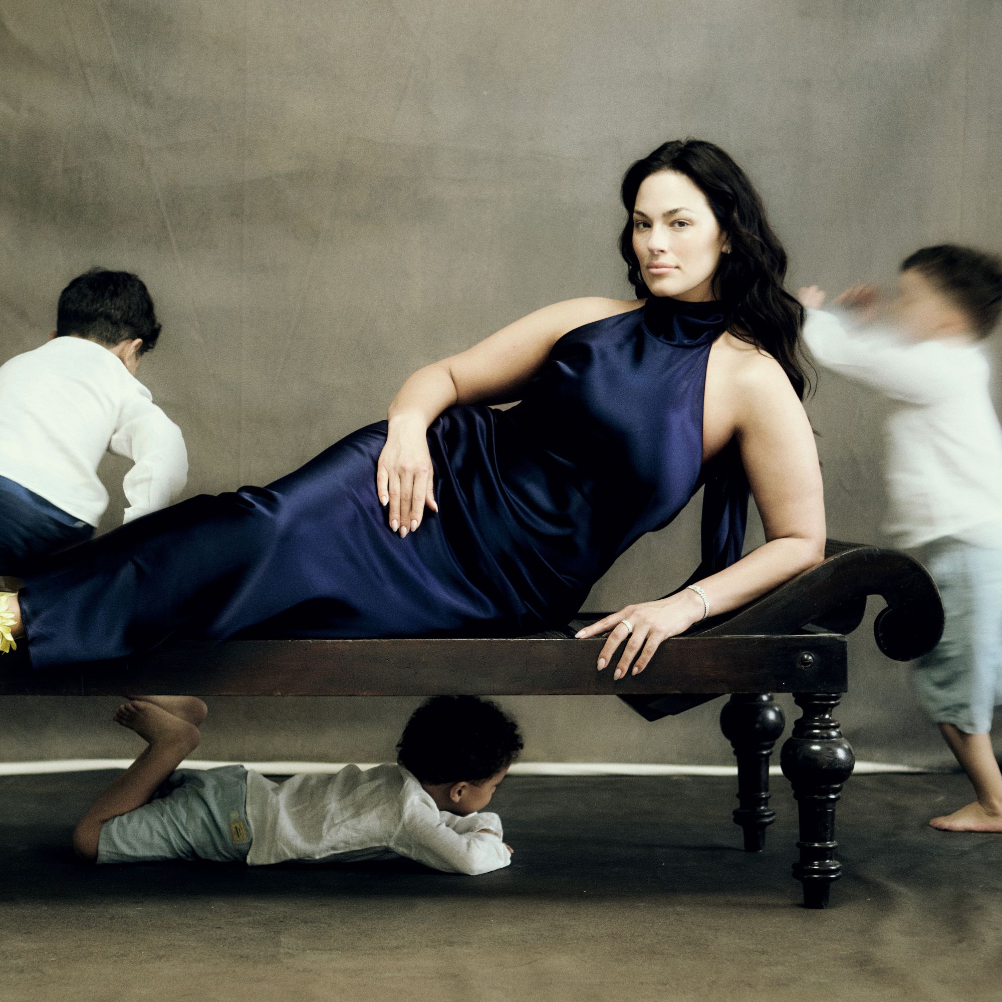 Ashley Graham poses for Marie Claire's latest cover story, as her kids play in the background