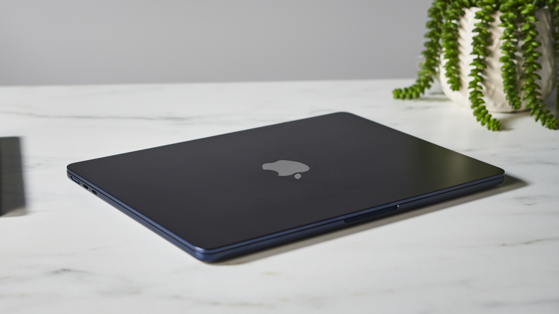 Apple MacBook Air (M2, 2022) on a white desk in the studio