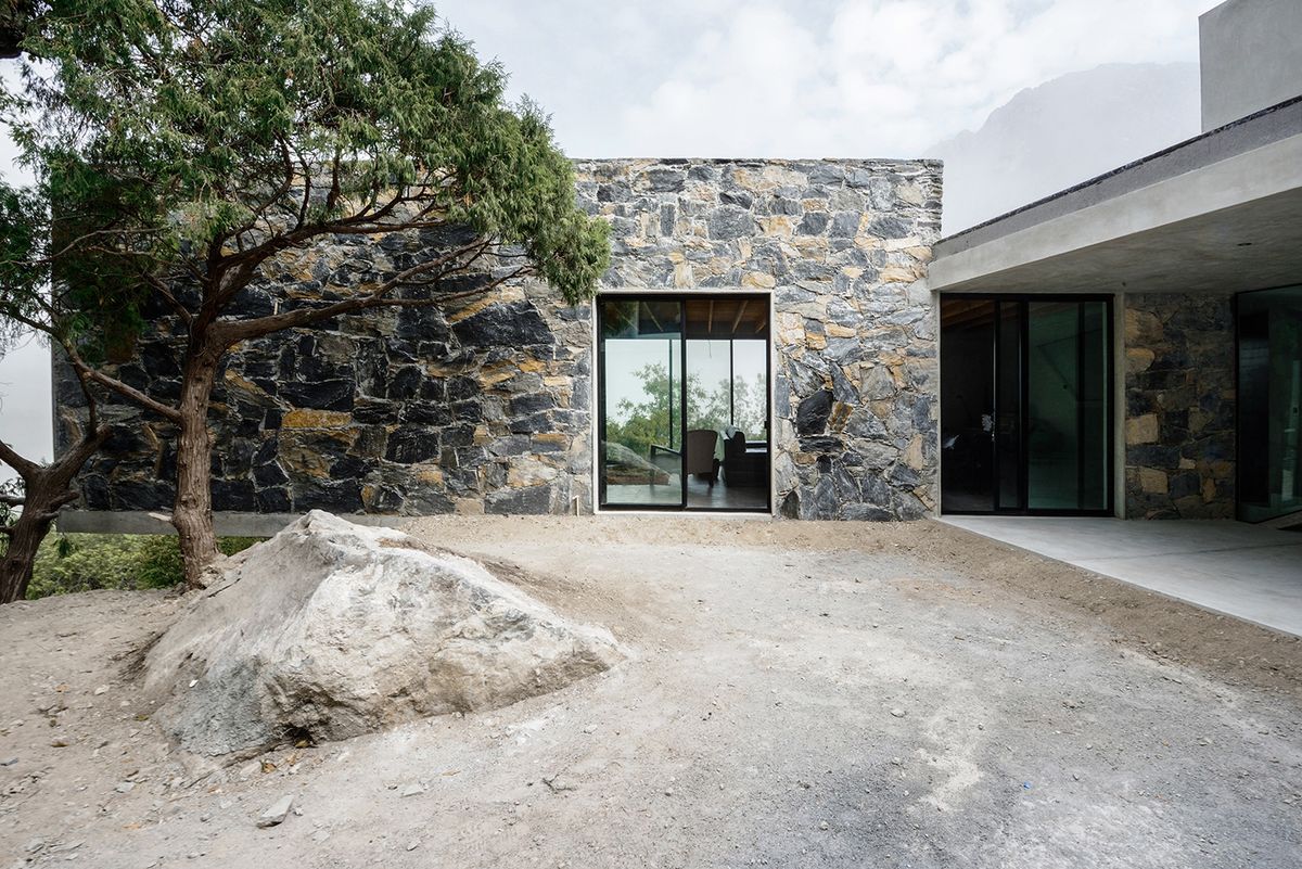 Concrete and stone layer into the landscape at Casa Bedolla in Mexico
