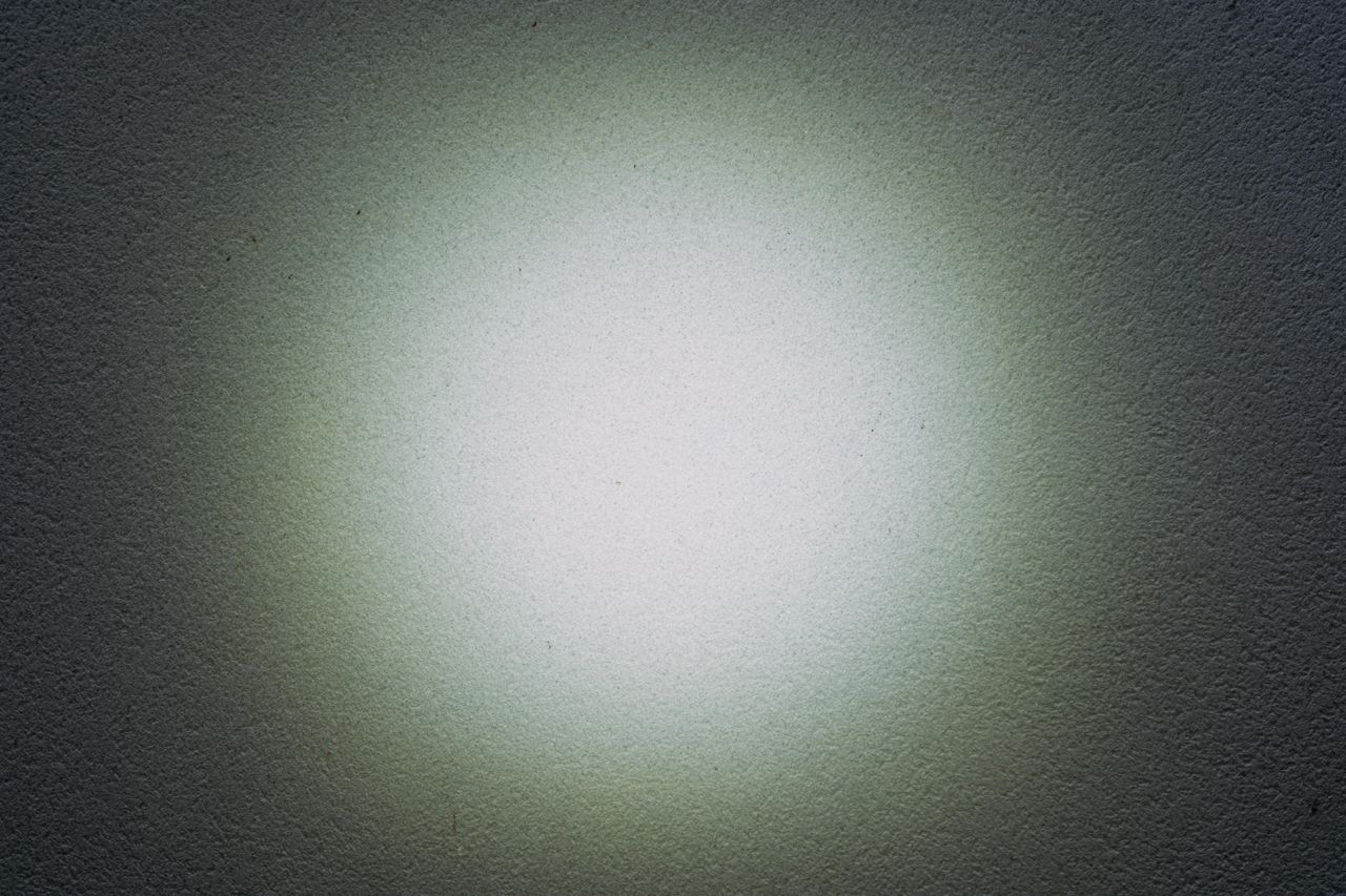 a pattern of light on a white wall