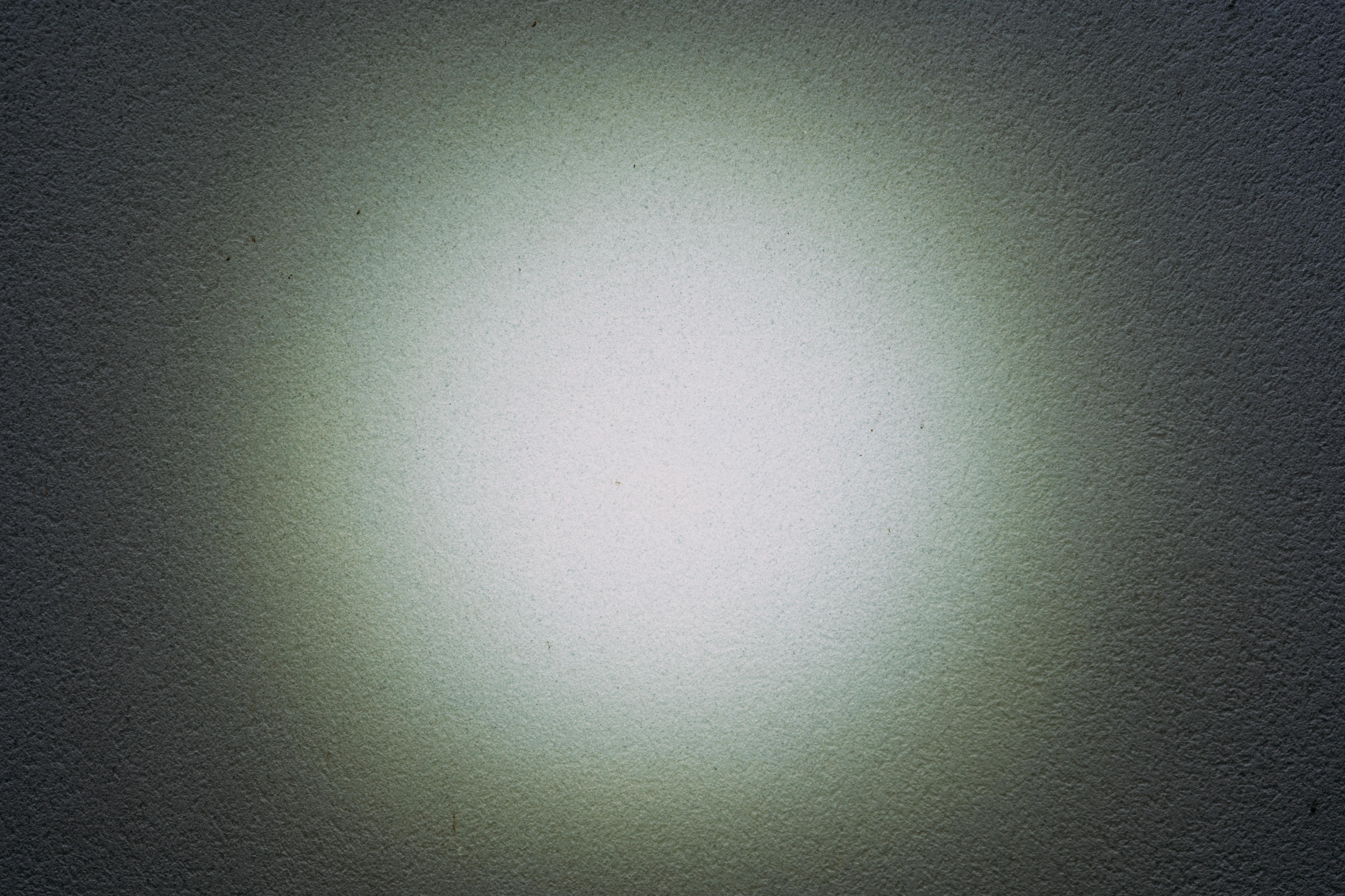 a pattern of light on a white wall