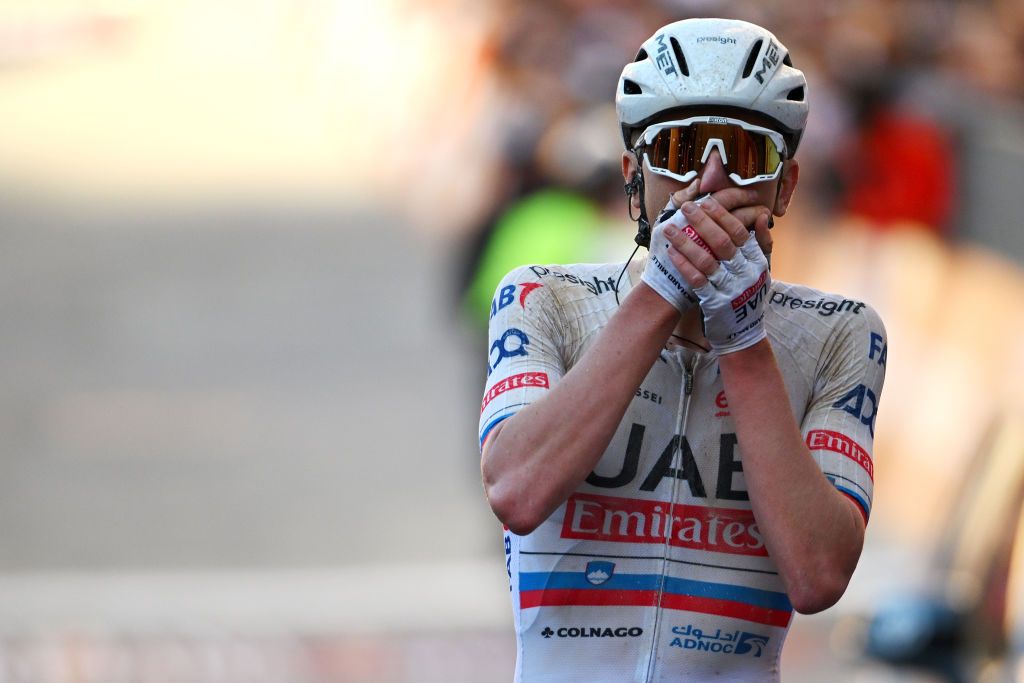 SIENA ITALY MARCH 02 Tadej Pogacar of Slovenia and UAE Team Emirates celebrates at finish line as race winner during the 18th Strade Bianche 2024 Mens Elite a 215km one day race from Siena to Siena 320m UCIWT on March 02 2024 in Siena Italy Photo by Tim de WaeleGetty Images