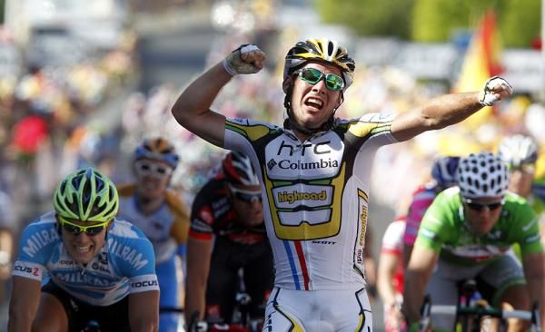 Mark Cavendish gives a joyful punch in the air after taking his Tour stage win.