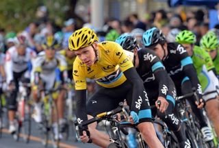 Tour de France winner Chris Froome shows of his maillot jaune at the head of the Saitama criterium in Japan.