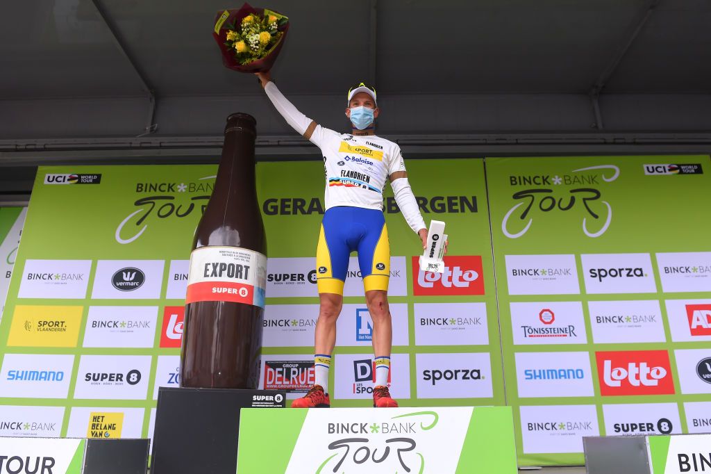 GERAARDSBERGEN BELGIUM OCTOBER 03 Podium Kenneth Van Rooy of Belgium and Team Sport Vlaanderen Baloise White Most Combative Rider Jersey Celebration Mask Covid safety measures Trophy Flowers during the 16th BinckBank Tour 2020 Stage 5 a 1836km stage from Ottignies Louvain la Neuve to Muur van Geraardsbergen 108m BinckBankTour BinckBankTour on October 03 2020 in Geraardsbergen Belgium Photo by Luc ClaessenGetty Images