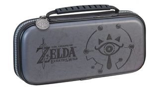 A photo of the Switch Lite case decorated with Zelda Breath of the Wild Sheikah Eye art