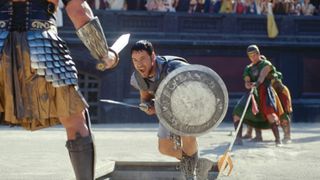 Russell Crowe in Gladiator screaming and holding a sword.