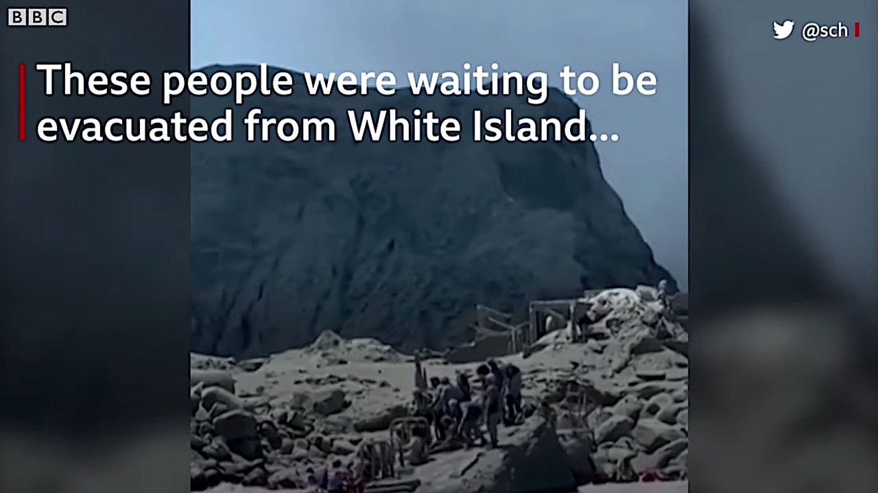 People waiting to be evacuated from White Island, New Zealand