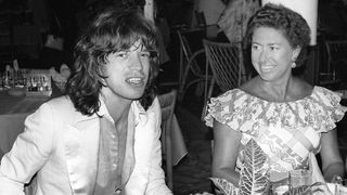Princess Margaret, the younger sister of Britain's Queen Elizabeth II, chats 08 December 1976 in a restaurant in Pointe-du-Bout, French West Indies, with Rolling Stone rocker Mick Jagger. Princess Margaret and her husband Earl of Snowdon, had two children, son Linley and daughter Sarah, but announced their separation in March 1976. When the marriage was officially ended two years later, Margaret became the first royal to divorce since Henry VIII in the 16th century.
