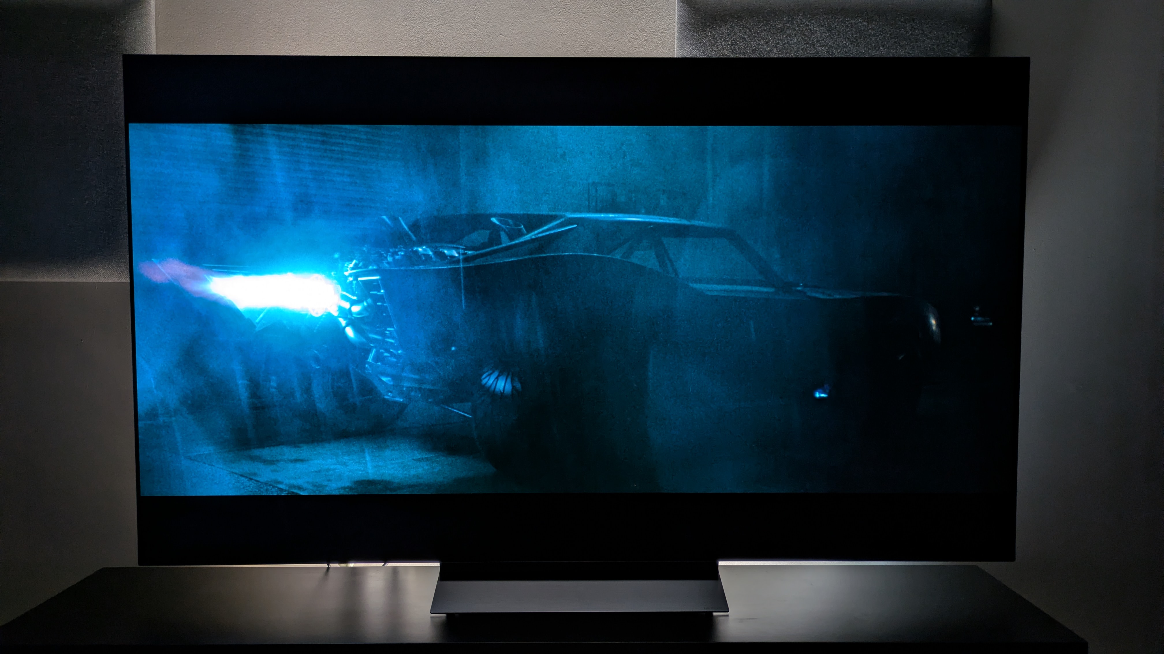 The LG C6 OLED TV with The Batman on screen, showing the Batmobile igniting its engine. The C6 delivers a punchy blue flame and does a good job delivering the rumble of the engine igniting