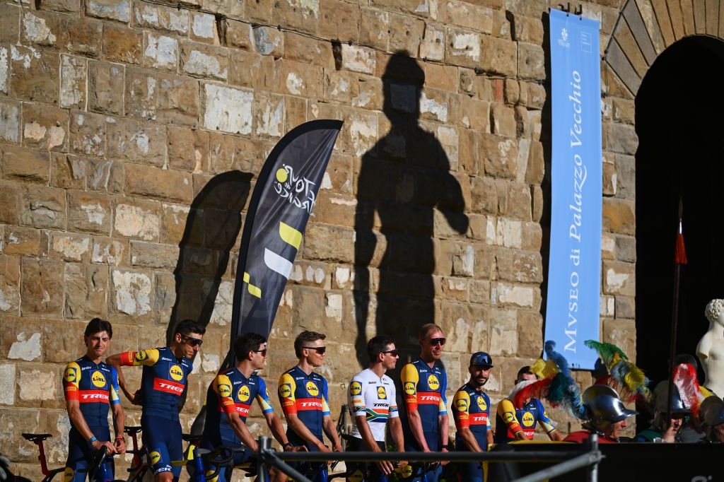 FIRENZE ITALY JUNE 27 Mads Pedersen of Denmark Giulio Ciccone of Italy Carlos Verona Quintanilla of Spain Ryan Gibbons of South Africa Tim Declercq of Belgium Toms Skujins of Latvia Julien Bernard of France Jasper Stuyven of Belgium and Team Lidl Trek with the shadow of Michelangelos David statue in the background during the 111th Tour de France 2024 Team Presentation UCIWT on June 27 2024 in Firenze Italy Photo by Dario BelingheriGetty Images