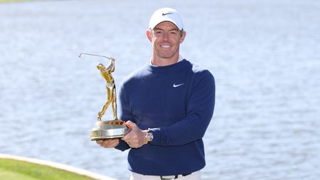 Rory McIlroy holds up The Players Championship trophy after winning in 2025