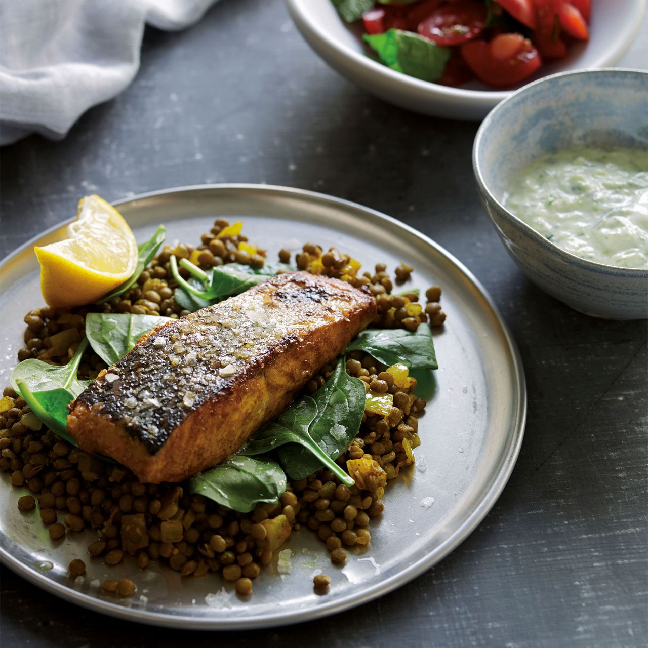 Tandoori salmon with spiced lentils and raita photo