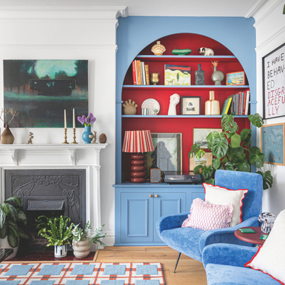 Blue built-in bookcases with red alcoves.