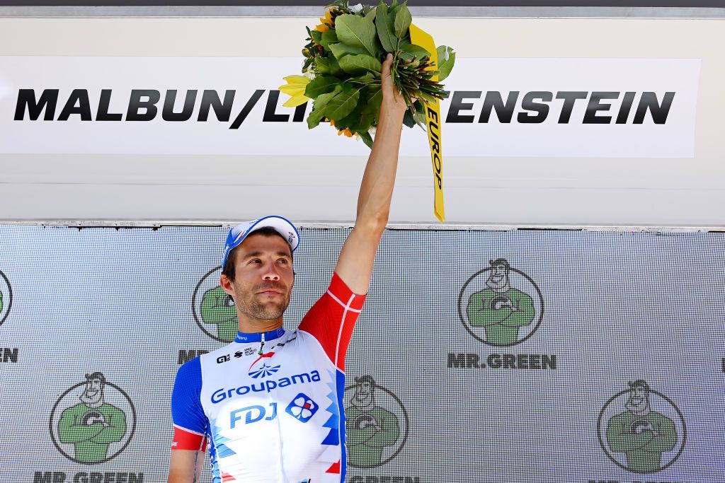 MALBUM SWITZERLAND JUNE 18 Thibaut Pinot of France and Team Groupama FDJ celebrates winning the stage on the podium ceremony after the 85th Tour de Suisse 2022 Stage 7 a 1946km stage from Ambri to Malbun 1560m tourdesuisse2022 WorldTour on June 18 2022 in Malbun Switzerland Photo by Tim de WaeleGetty Images