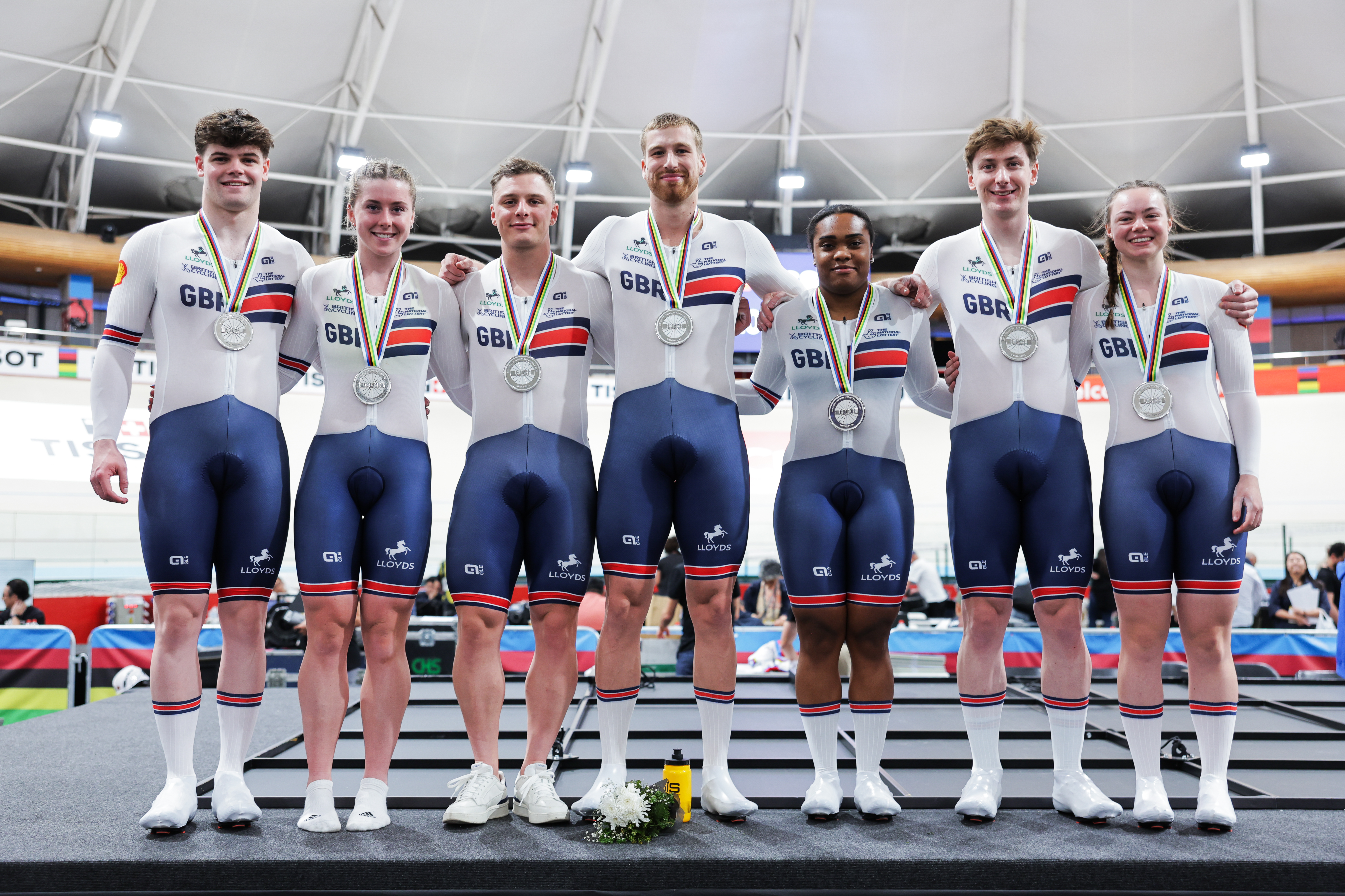 The men&#039;s and women&#039;s British team sprint squad line up with the gold medals