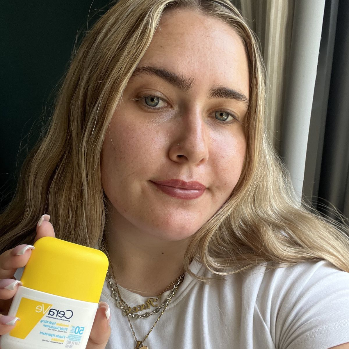 Amelia wearing cerave hydrating fluid spf 50