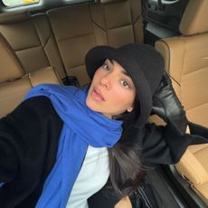 An image of @kendalljenner wearing a knitted hat, one of the biggest winter trends for 2025.