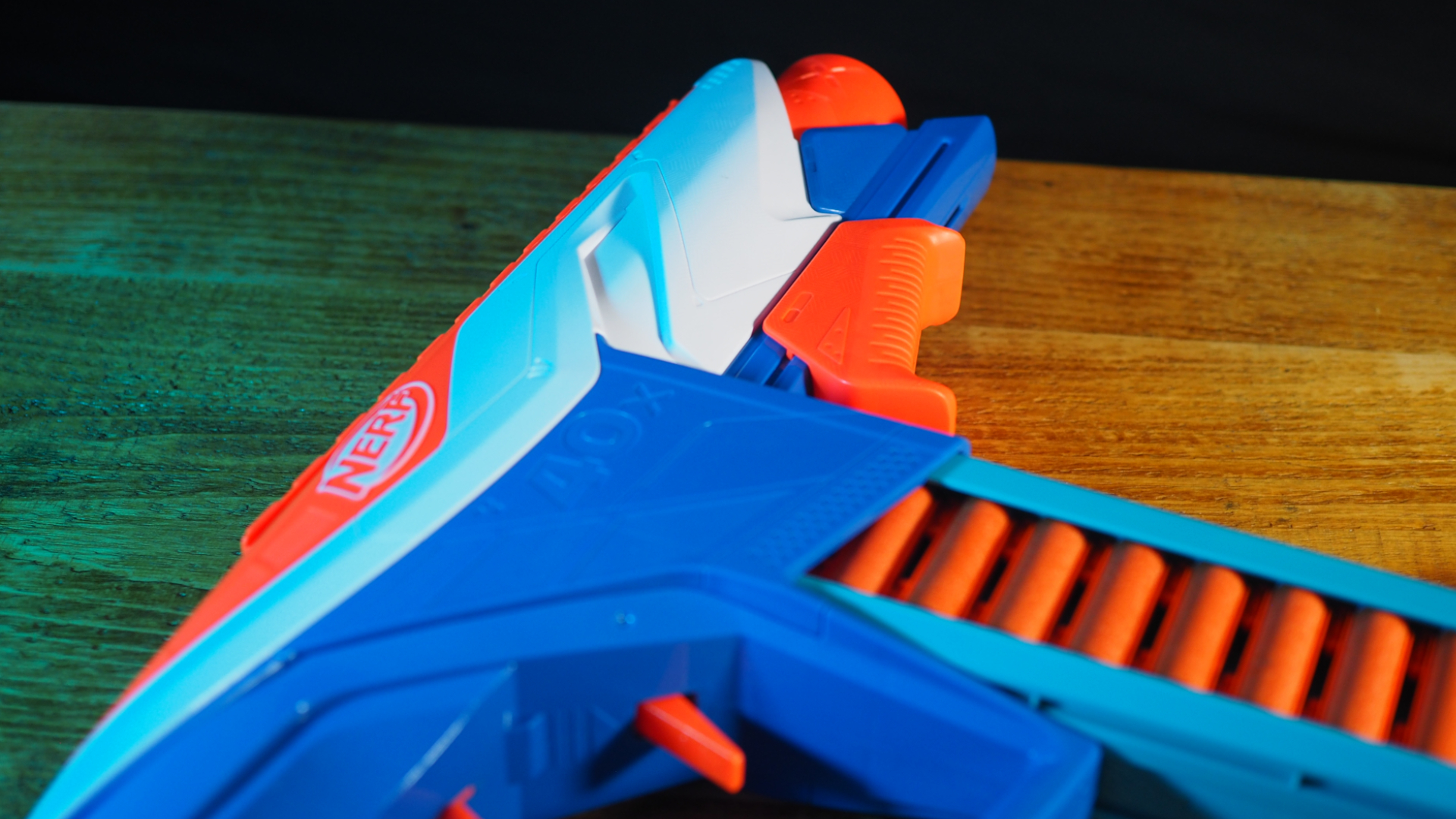 A Nerf N-Series Infinite blaster lying on a wooden table