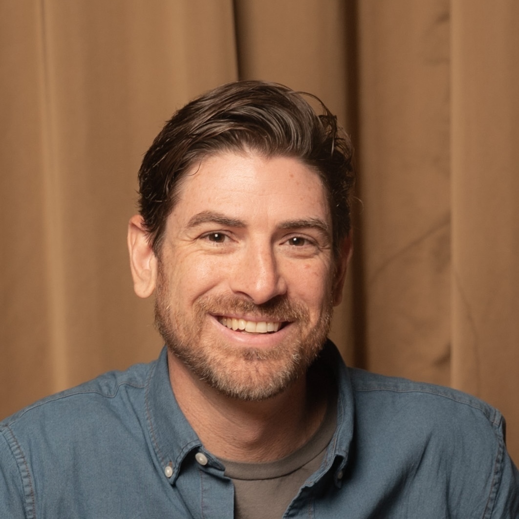 Reverb&amp;rsquo;s Senior Director of Analytics, Cyril Nigg, pictured in a blue shirt against a brown curtain