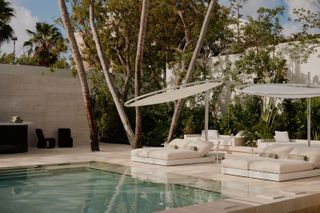 Pool and loungers at Palm Heights Hotel Spa