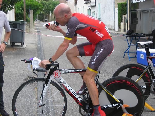 Chris Horner stays hydrated while warming up for the time trial.