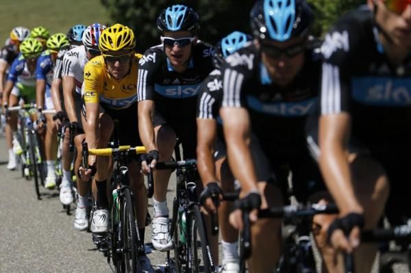 Bradley Wiggins (Sky) sits in the peloton, protected by his Sky teammates