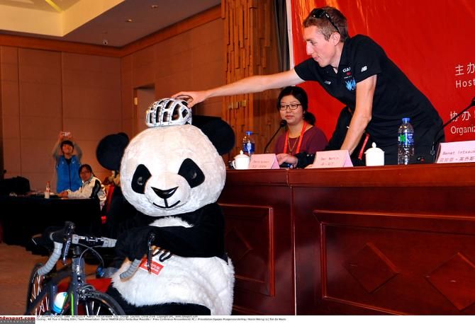 Dan Martin gives the panda some head protection
