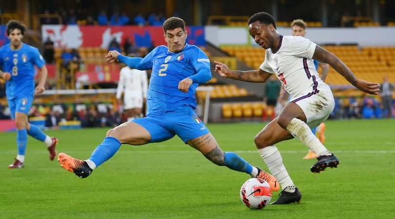 England&#039;s Raheem Sterling is challenged by Italy&#039;s Giovanni Di Lorenzo in the teams&#039; Nations League clash at Molineux.