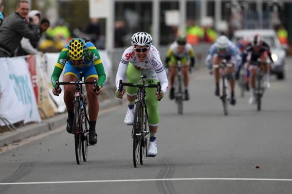 Suzanne De Goede (Skil Argos)begins to celebrate her win ahead of Chantal Blaak (AA Drink), Megan Guarnier(Tibco) was third