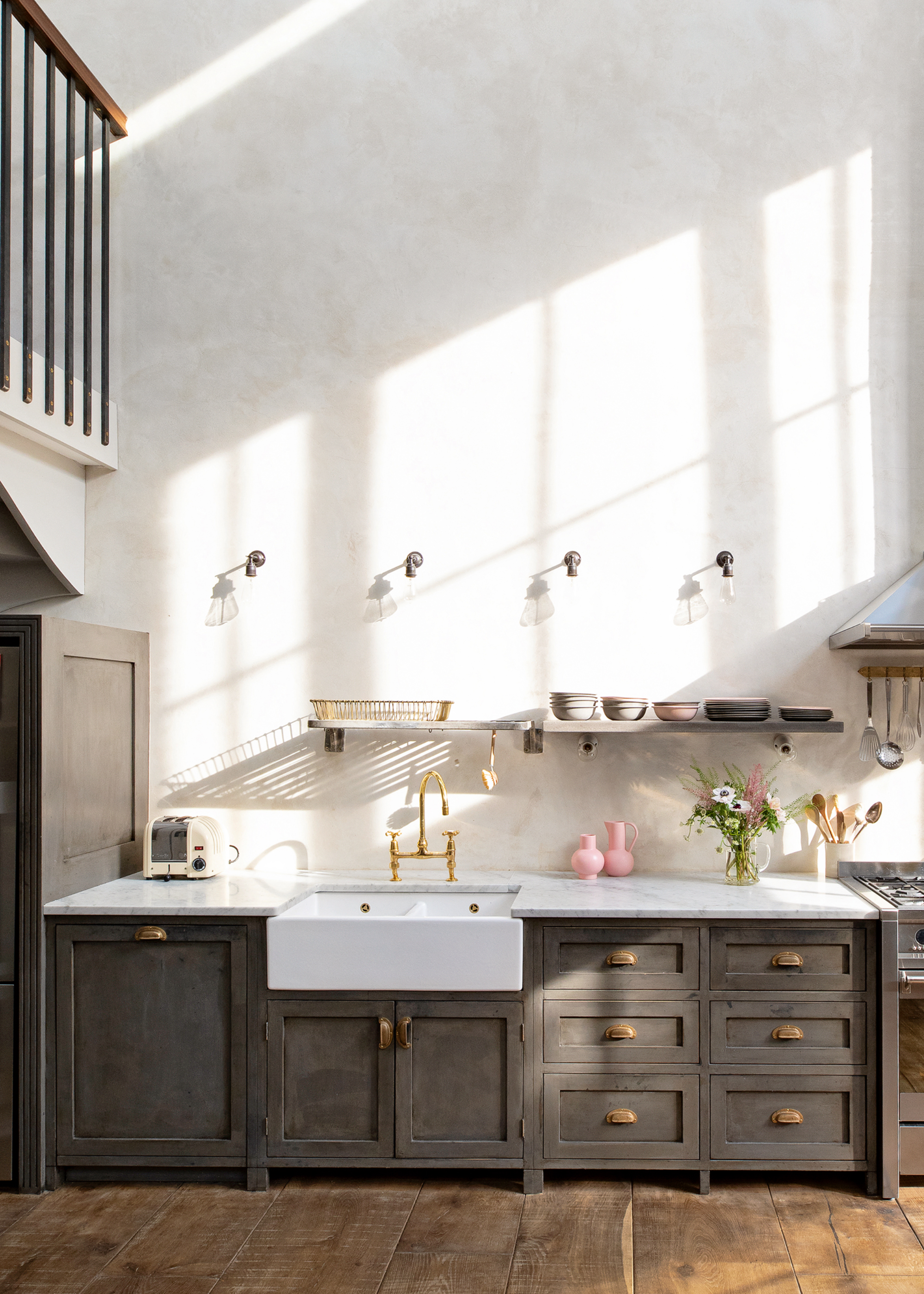 Dark grey kitchen in large open plan space