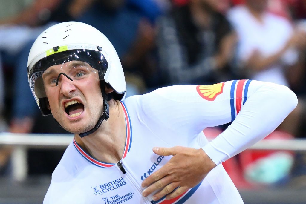 Great Britains Daniel Bigham celebrates his teams victory after winning the Mens Team Pursuit finals during the UCI Track Cycling World Championships at the Velodrome of SaintQuentinenYvelines southwest of Paris on October 13 2022 Photo by AnneChristine POUJOULAT AFP Photo by ANNECHRISTINE POUJOULATAFP via Getty Images