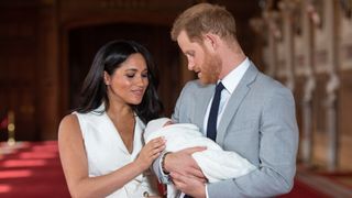 Prince Harry, Duke of Sussex and Meghan, Duchess of Sussex, with their newborn son Archie at Windsor Castle on May 8, 2019
