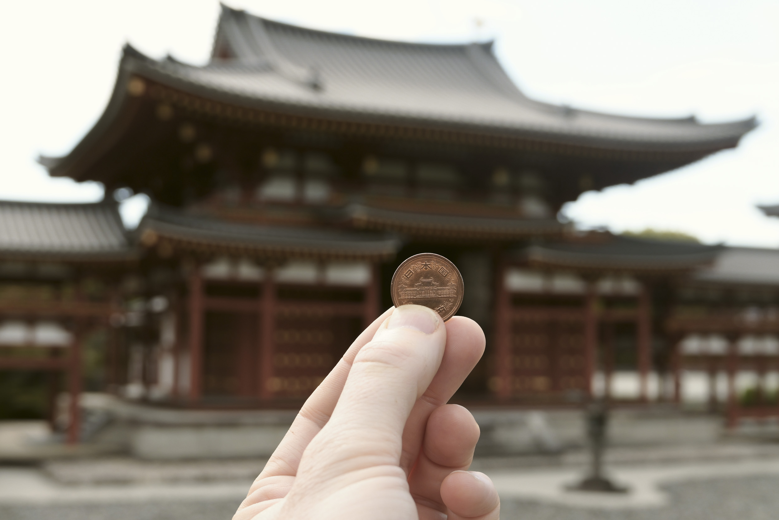 Sample image taken with the Panasonic Lumix L10; a Japanese temple, with a coin held in front of it of that very temple