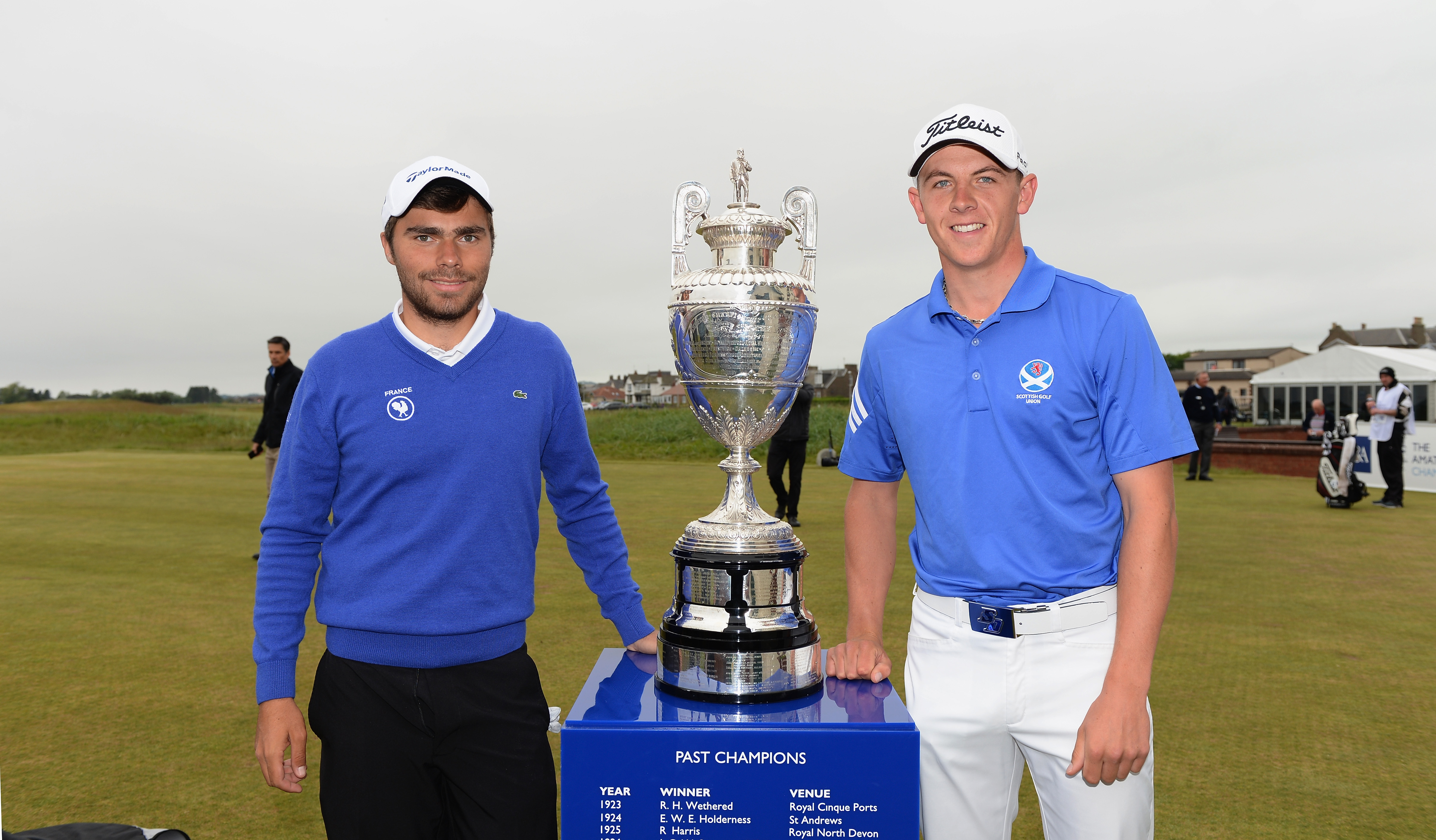 Romain Langasque (left) and Grant Forrest stand either side of The Amateur Championship trophy in 2015