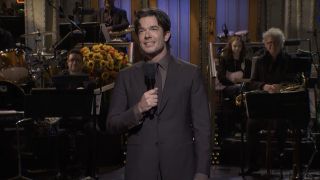 John Mulaney performing stand-up in the monologue for his sixth time hosting SNL