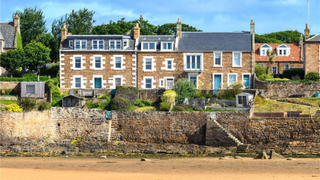 Terraced homes overlooking a sandy beach