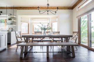 neutral dining room and open plan kitchen with off white window blinds in bay window