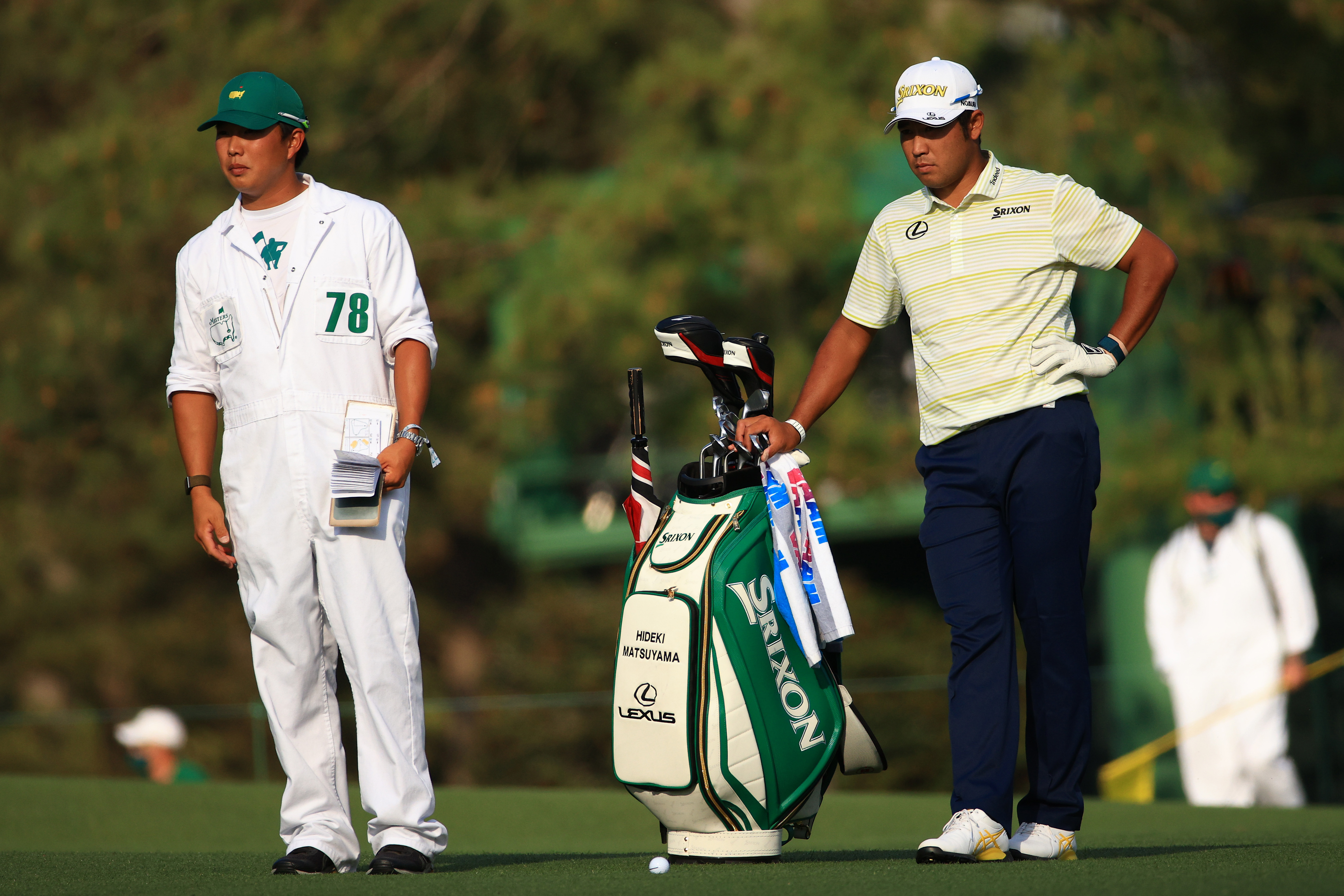 Hideki Matsuyama and his caddie talk