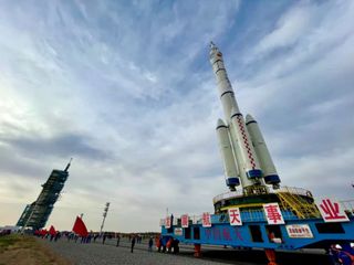The Long March 2F to launch Shenzhou 13 crew spacecraft being vertically transferred to the pad at Jiuquan, Oc. 7, 2021.