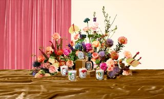 Diptyque candles and perfume with flowers by Maurice Harris