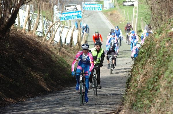 Lampre's Danilo Hondo passes a cyclotourist.