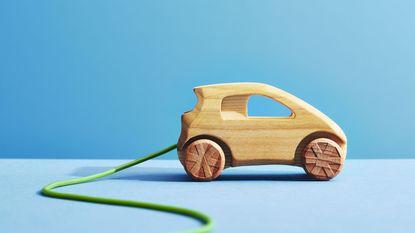 wooden toy EV for electric vehicle lease story