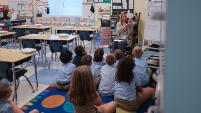 A teacher reads to schoolchildren in Palm Bay, Florida. 