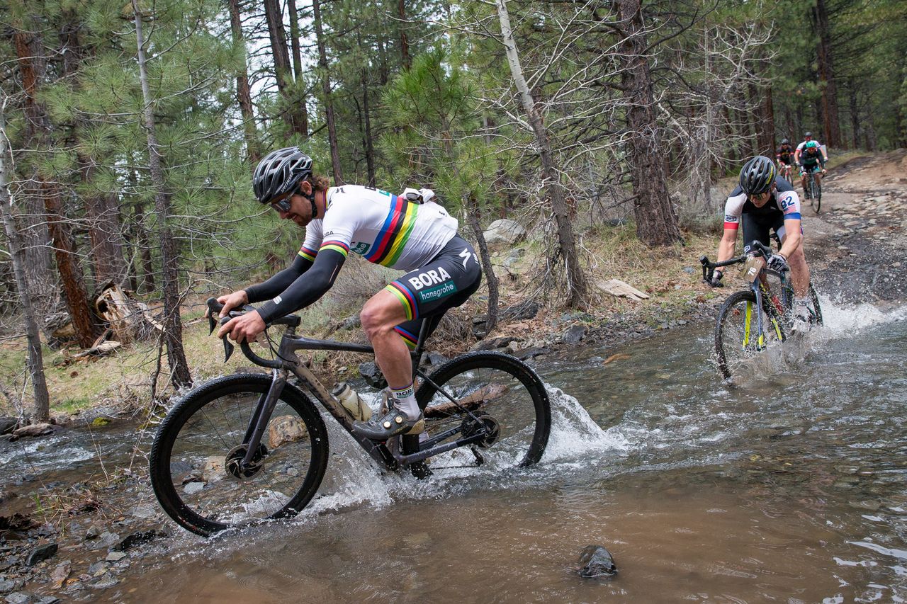 Peter Sagan crosses a river during the Sagan Fondo