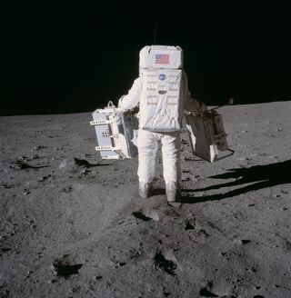 Buzz Aldrin carries equipment on the moon in July 1969, during Apollo 11. The astronauts had to adjust quickly to the lighter surface gravity of the moon.