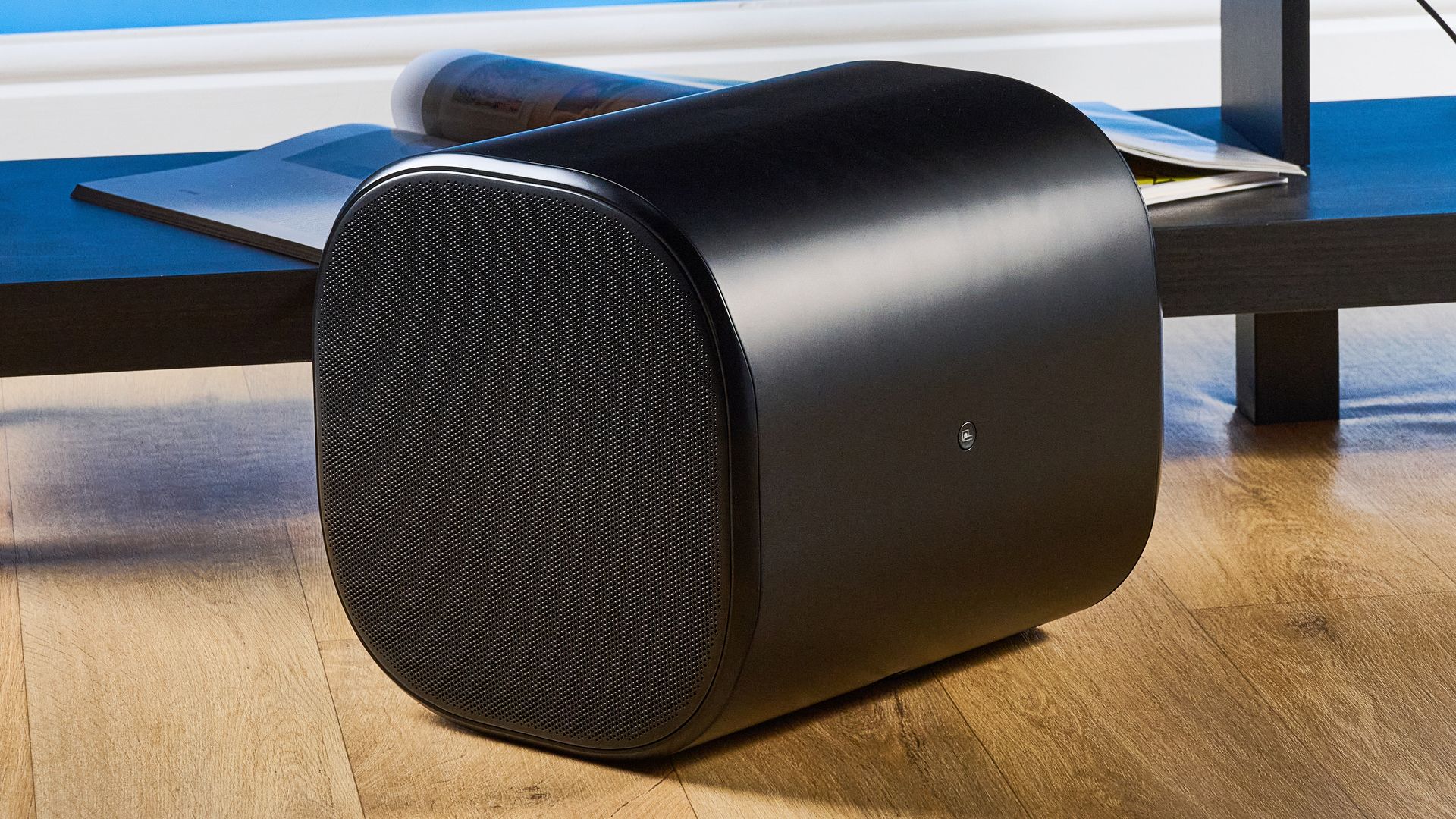 the jbl bar 1300xmk2 in black photographed against the blue tom's guide background