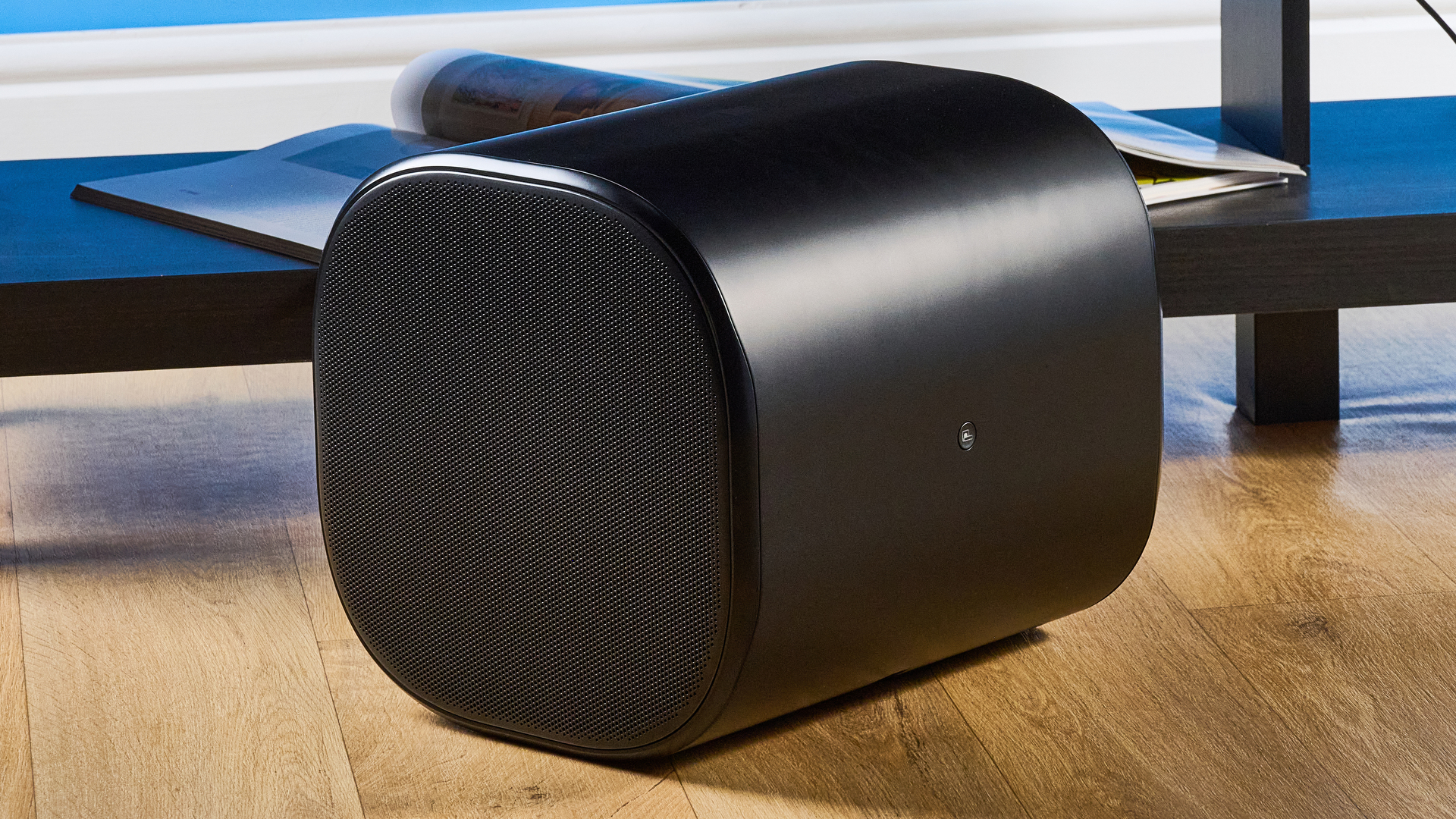 the jbl bar 1300xmk2 in black photographed against the blue tom's guide background