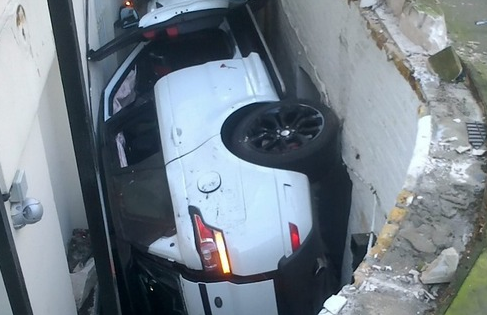 This is what a $130,000 Land Rover looks like after it falls 14 feet and gets crushed