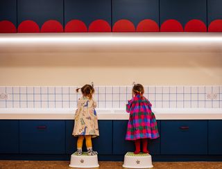 kids washing hands in colourful Two Hands nursery by vPPR